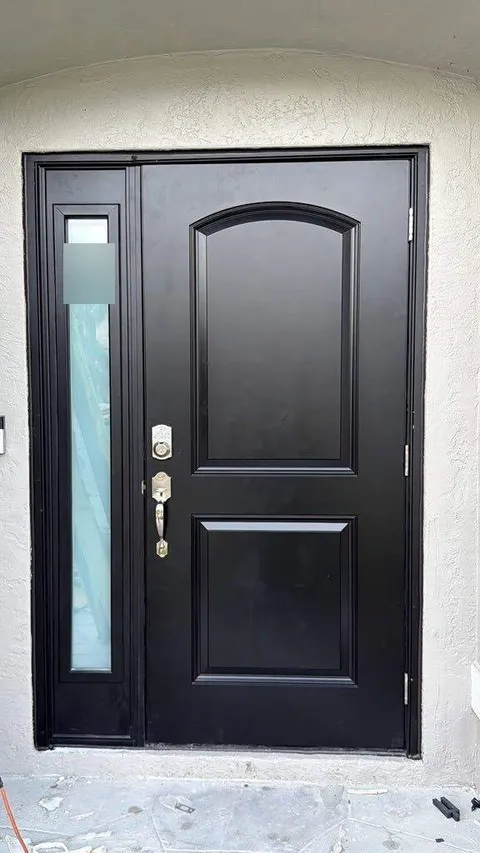 Black single impact fiberglass door with a narrow glass sidelite